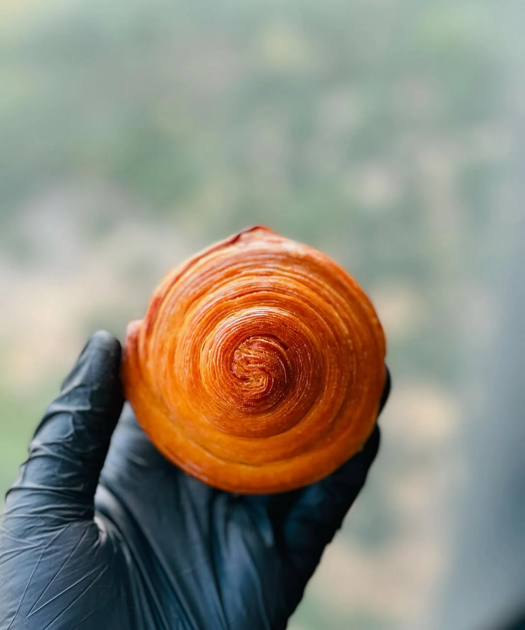 Coil — 81-layer butter croissant hand-rolled to a vinyl spiral